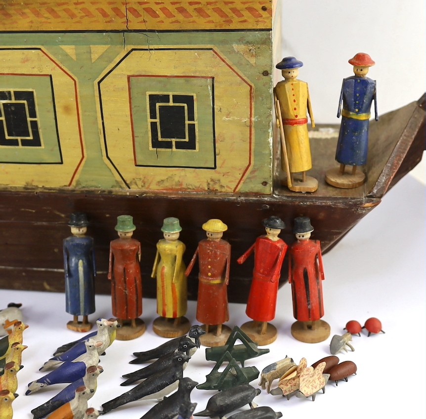 A late 19th century German painted wood Noah's Ark with 136 assorted figures and animals, 14cm wide, 54cm long, 30cm high, largest figure 8cm